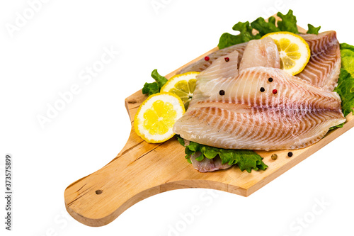 Whitefish Tilapia Fish Raw Fillet Isolated on White Background. Selective focus.