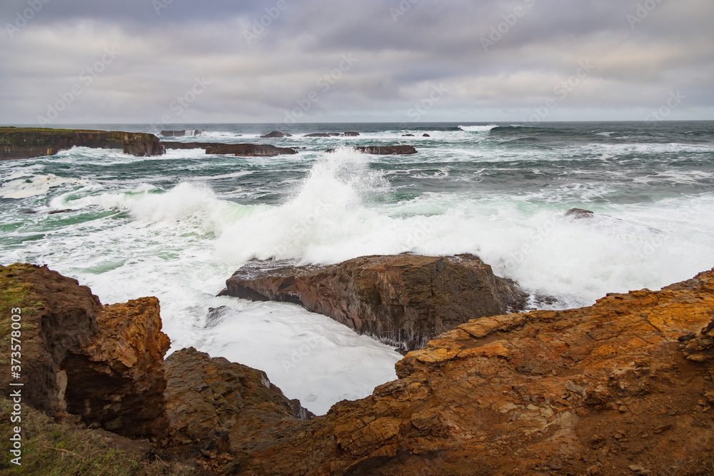 Waves breaking on California coastline 