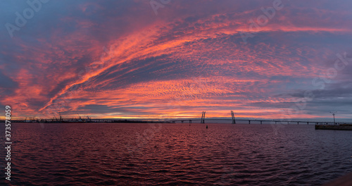 Panorama of the bridge over the bay during sunset
