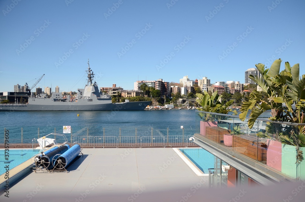 Andrew (Boy) Charlton Pool looking over to Australian Naval Base at Woolloomooloo and naval vessel