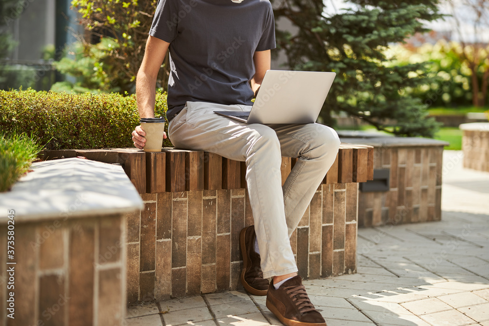 Caucasian male freelancer working on his laptop Caucasian male freelancer working on his laptop