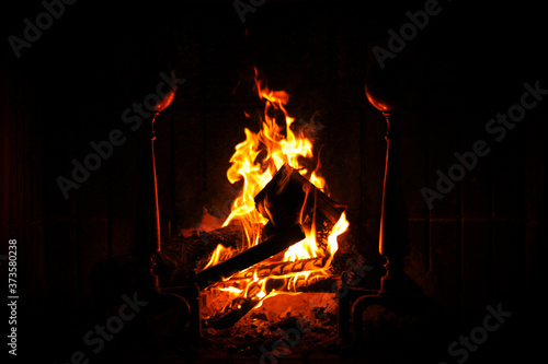 Burning Fireplace with logs and black background