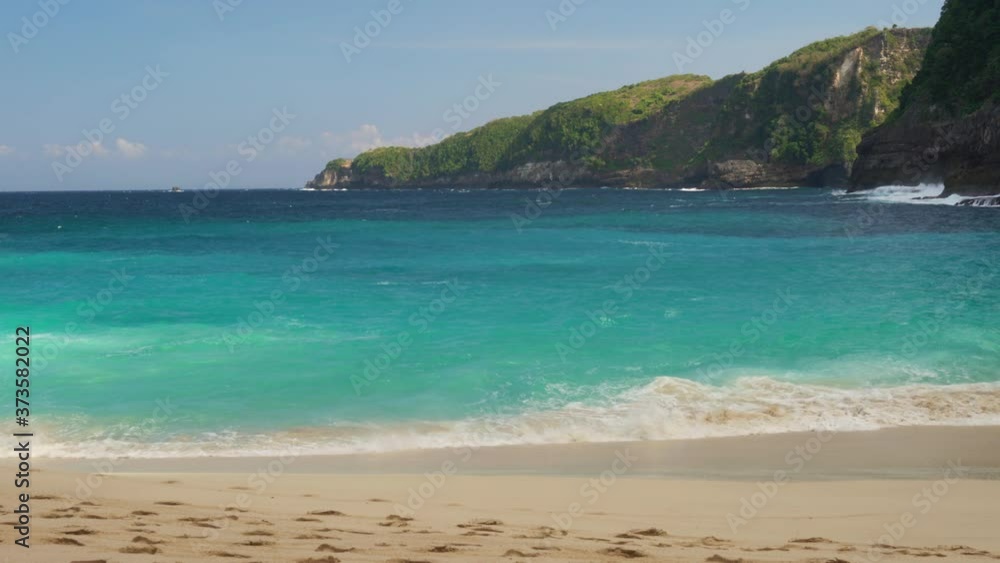 Azure beach with rocky mountains and clear water of Indian ocean at sunny day. 4K Azure beach with rocky mountains and clear water of Indian ocean at sunny day. 4K