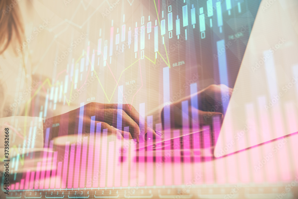 Double exposure of woman hands working on computer and forex graph hologram drawing. Financial analysis concept. Double exposure of woman hands working on computer and forex graph hologram drawing. Financial analysis concept.
