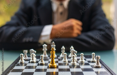 Wallpaper Mural One chess pieces staying against full set of chess pieces with background of businessman. Strategy, Planning and Decision concept Torontodigital.ca