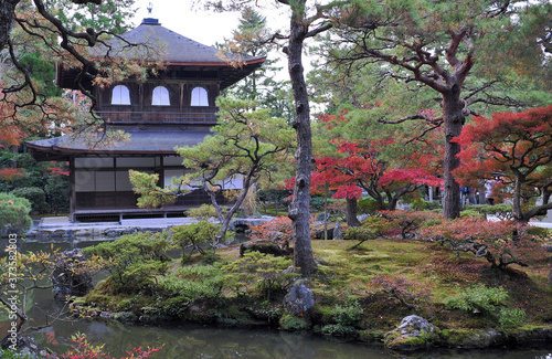 Breathtaking view on old traditional temple in japan garden during autumn season.