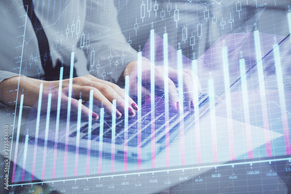 Multi exposure of woman hands typing on computer and financial graph hologram drawing. Stock market analysis concept. Multi exposure of woman hands typing on computer and financial graph hologram drawing. Stock market analysis concept.