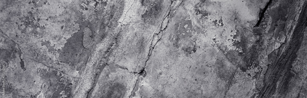 Fototapeta premium Panoramic background - old dark concrete wall with cracks
