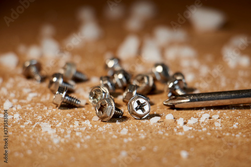 Wallpaper Mural Metal screws on wooden table with salt stones Torontodigital.ca