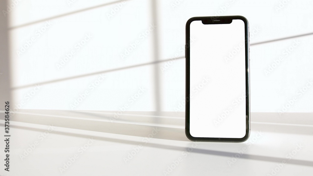 A photo of a black smartphone on a white background A photo of a black smartphone on a white background