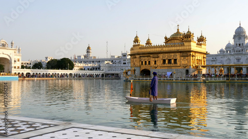 guard in a boat at golden temple in amritsar