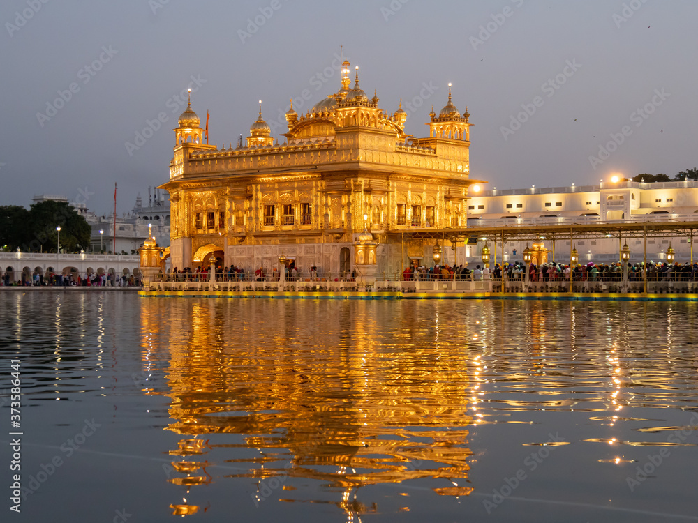 a medium view of the famous golden temple at dusk in amritsar