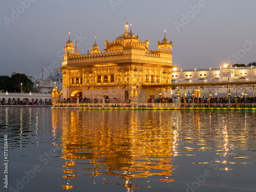 a medium view of the famous golden temple at dusk in amritsar