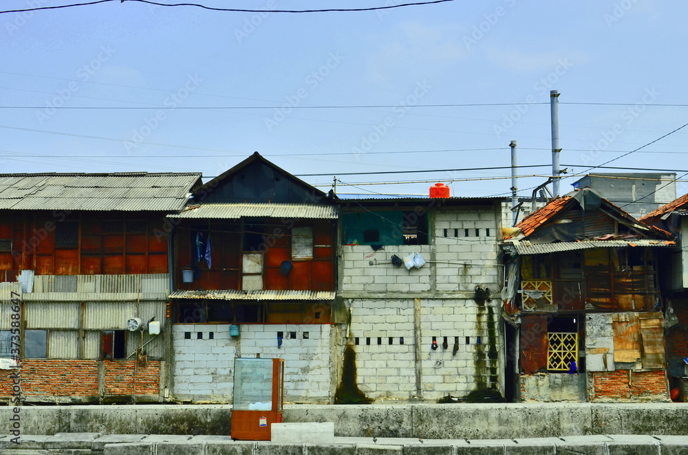 Slum house on the edge of a canal in Jakarta