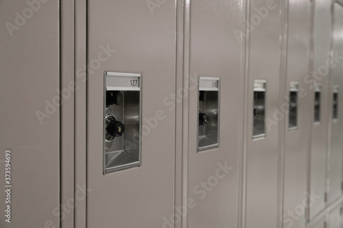 Row of Beige Middle or High School Lockers and Locks