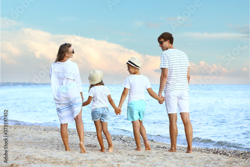 Happy family on sea beach a...