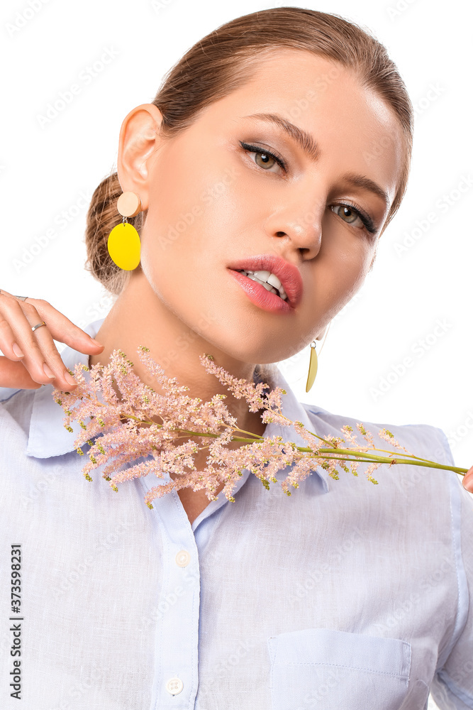 Beautiful young woman wearing stylish jewelry on white background Beautiful young woman wearing stylish jewelry on white background