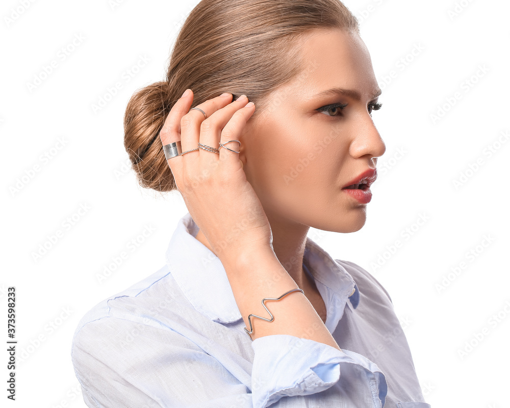 Beautiful young woman wearing stylish jewelry on white background Beautiful young woman wearing stylish jewelry on white background