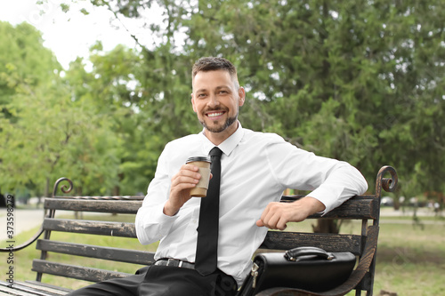 Handsome businessman relaxi...