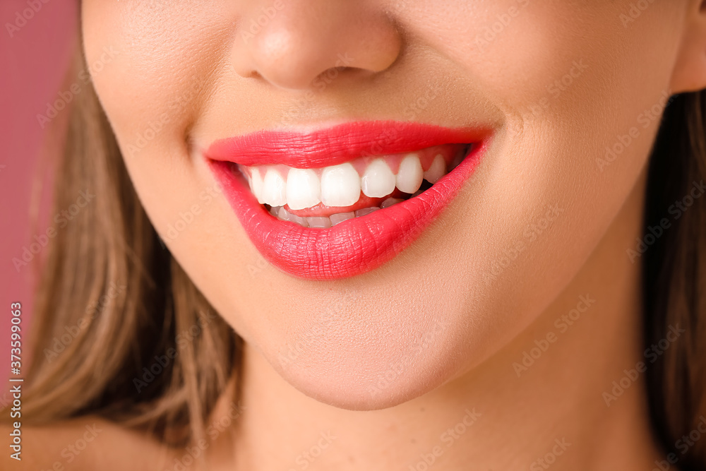 Fototapeta premium Beautiful young woman with bright lipstick, closeup
