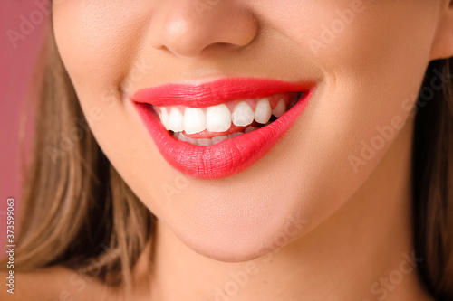 Beautiful young woman with bright lipstick  closeup