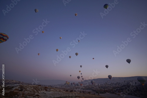 Hot air balloon flying over rock landscape at Cappadocia Turkey © Hirotsugu
