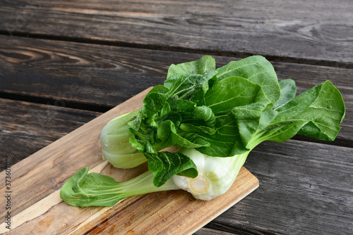 Bok choy or Chinese-cabbage on wooden board and wooden floor..Bok choy is the best leafy green vegetable.