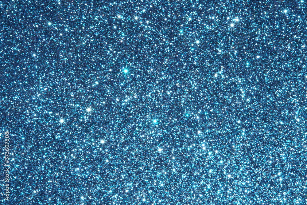 Fototapeta premium blue Sparkling Lights Festive background with texture. Abstract Christmas twinkled bright bokeh defocused and Falling stars. Winter Card or invitation 