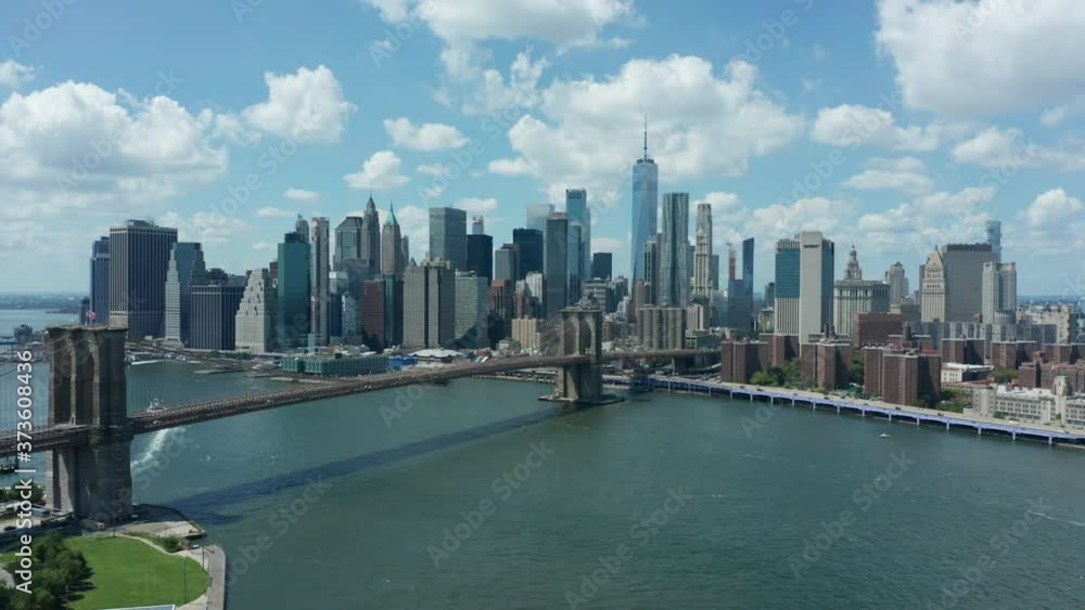day day view of downtown NYC flying backward over Manhattan Bridge day day view of downtown NYC flying backward over Manhattan Bridge