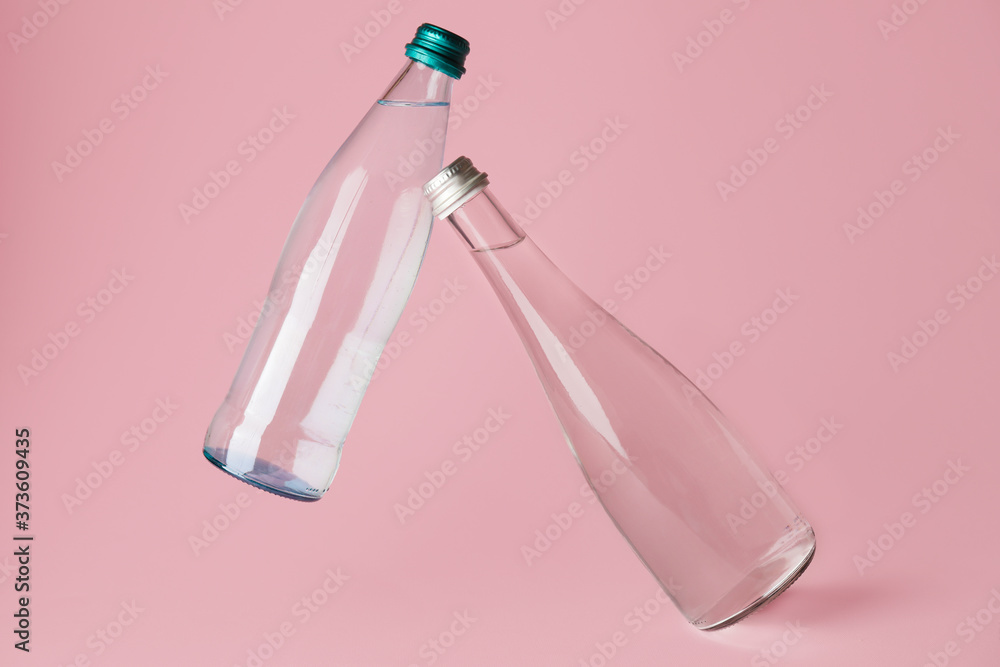 Bottles of clean water on color background Bottles of clean water on color background