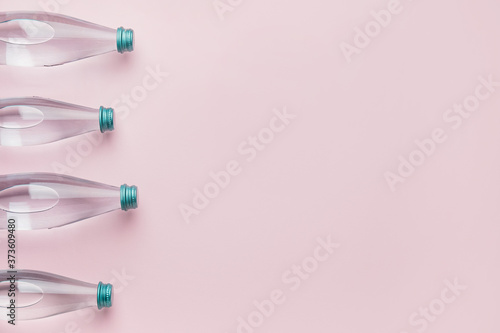 Bottles of clean water on color background © Pixel-Shot