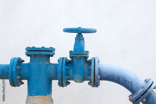 Принти на полотні Large water supply valve with a white background of the cement wall