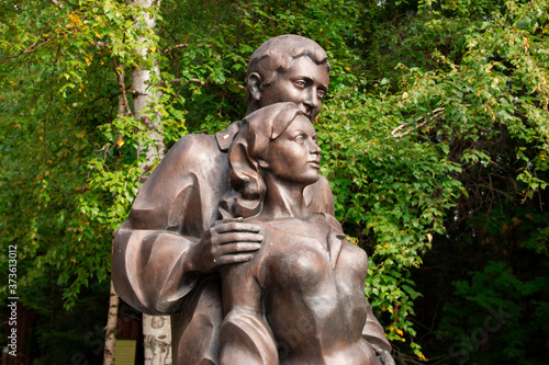 Sculpture in the forest  depicting a pair of lovers - a man and a woman.