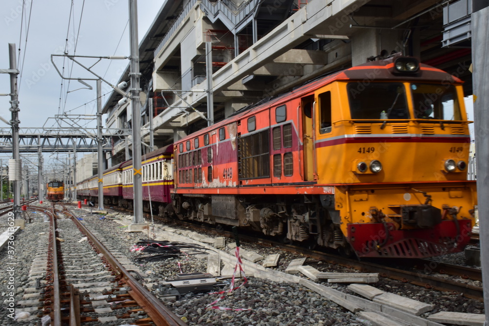 Trains running on the train tracks to the station in Thailand. Select focus with shallow depth of field.