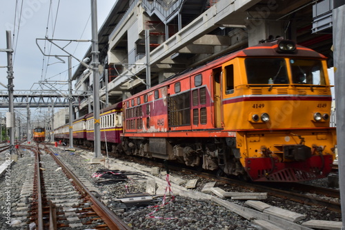 Trains running on the train tracks to the station in Thailand. Select focus with shallow depth of field.