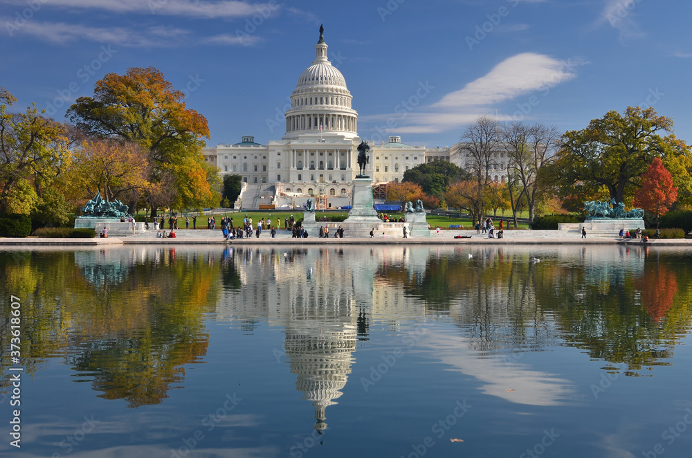 Fototapeta premium U.S. Capitol Building and its reflection over the pool in autumn foliage - Washington D.C. United States of America