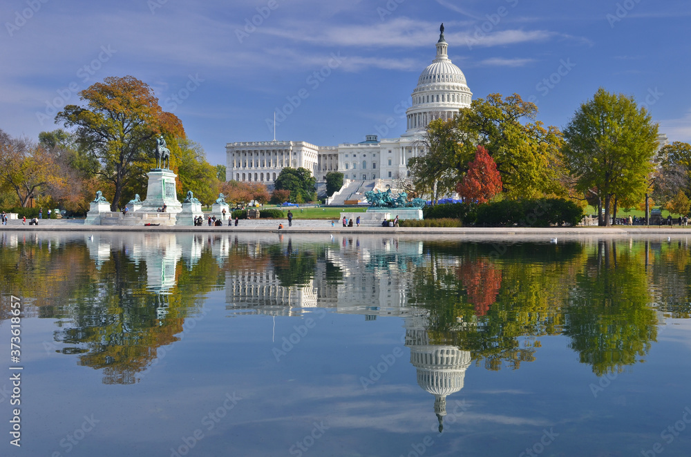 U.S. Capitol Building and its reflection over the pool in autumn foliage - Washington D.C. United States of America