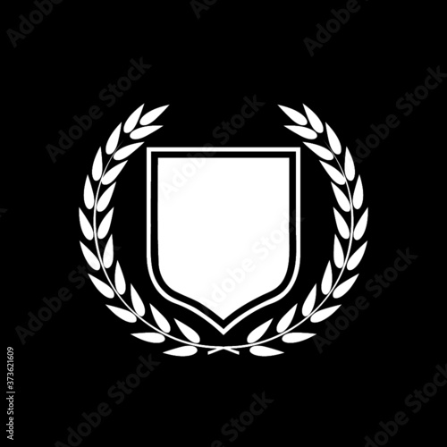 Empty royal shield with a laurel wreath icon isolated on dark background