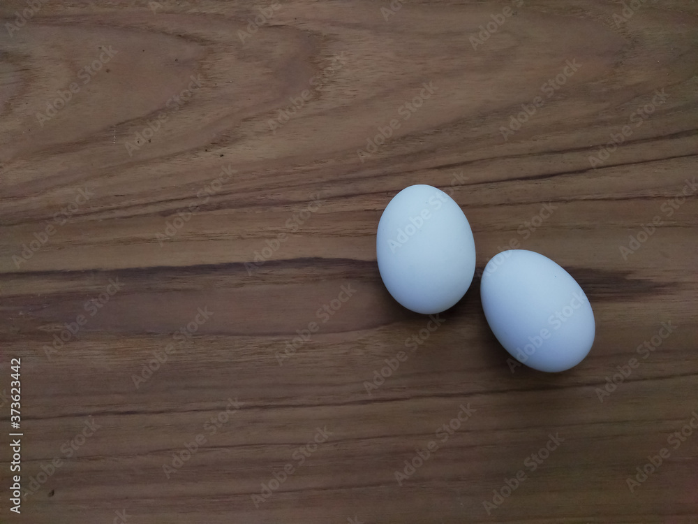 egg on wooden table egg on wooden table