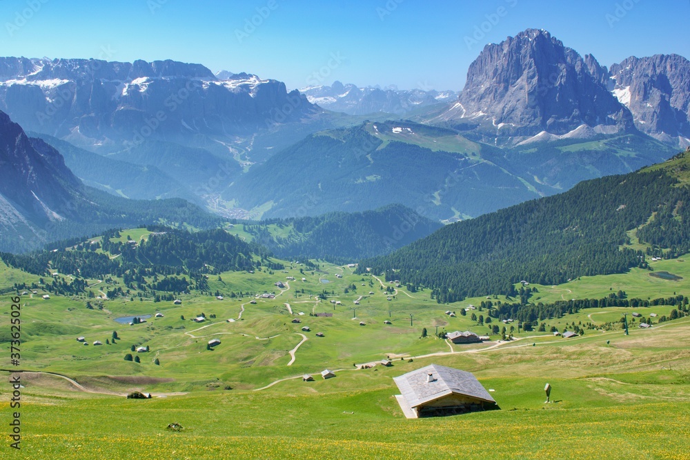 Beautiful summer mountain scenery with rural barns , Seceda, Dolomites Italy, European Alps.