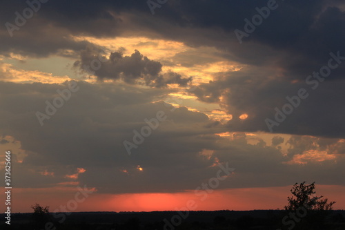 
clouds in the red sunset of a summer evening