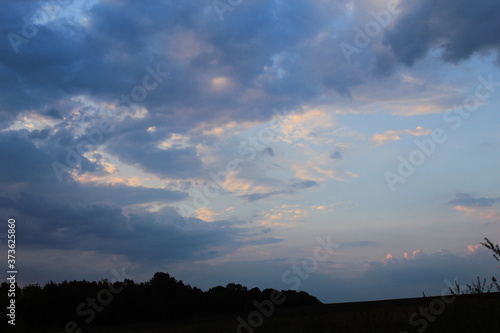 
clouds in the red sunset of a summer evening