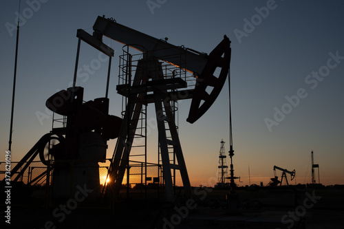 Oil Pump on orange sunset