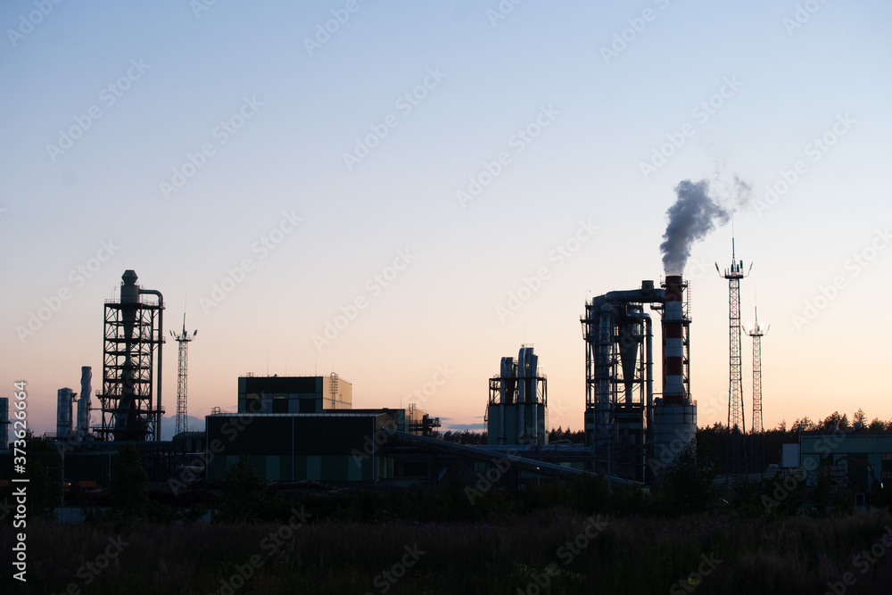 Factory pipe polluting air against sunset, environmental problems, smoke from chimneys