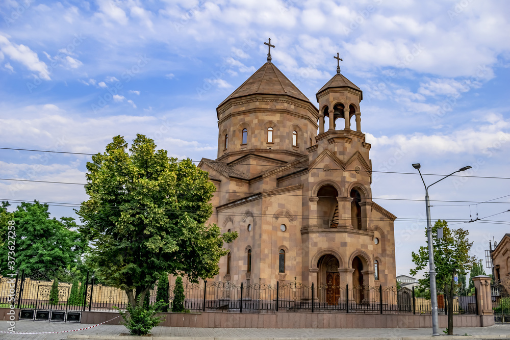 Dnipro, Ukraine - July 20, 2020: Armenian Apostolic Church of St. Gregory the Illuminator in Dnipro. A beautiful building of a Christian temple with a facade of peach-colored tuff volcanic stone