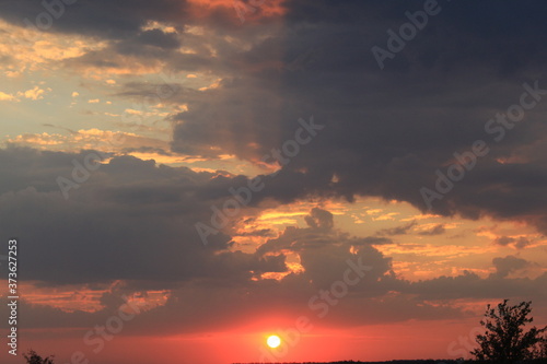 
clouds in the red sunset of a summer evening