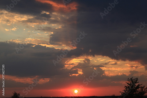 
clouds in the red sunset of a summer evening
