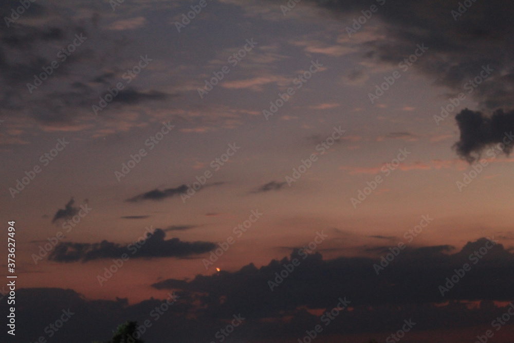 
clouds in the red sunset of a summer evening