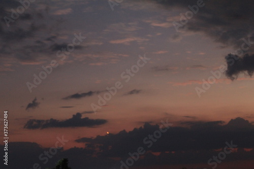 
clouds in the red sunset of a summer evening