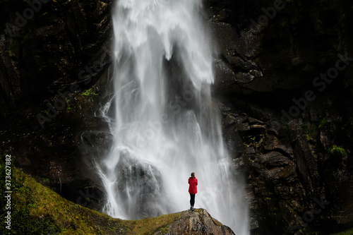 Woman under waterfall 